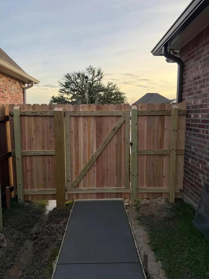 Inside of a new wood gate showing its rails and diagonal brace