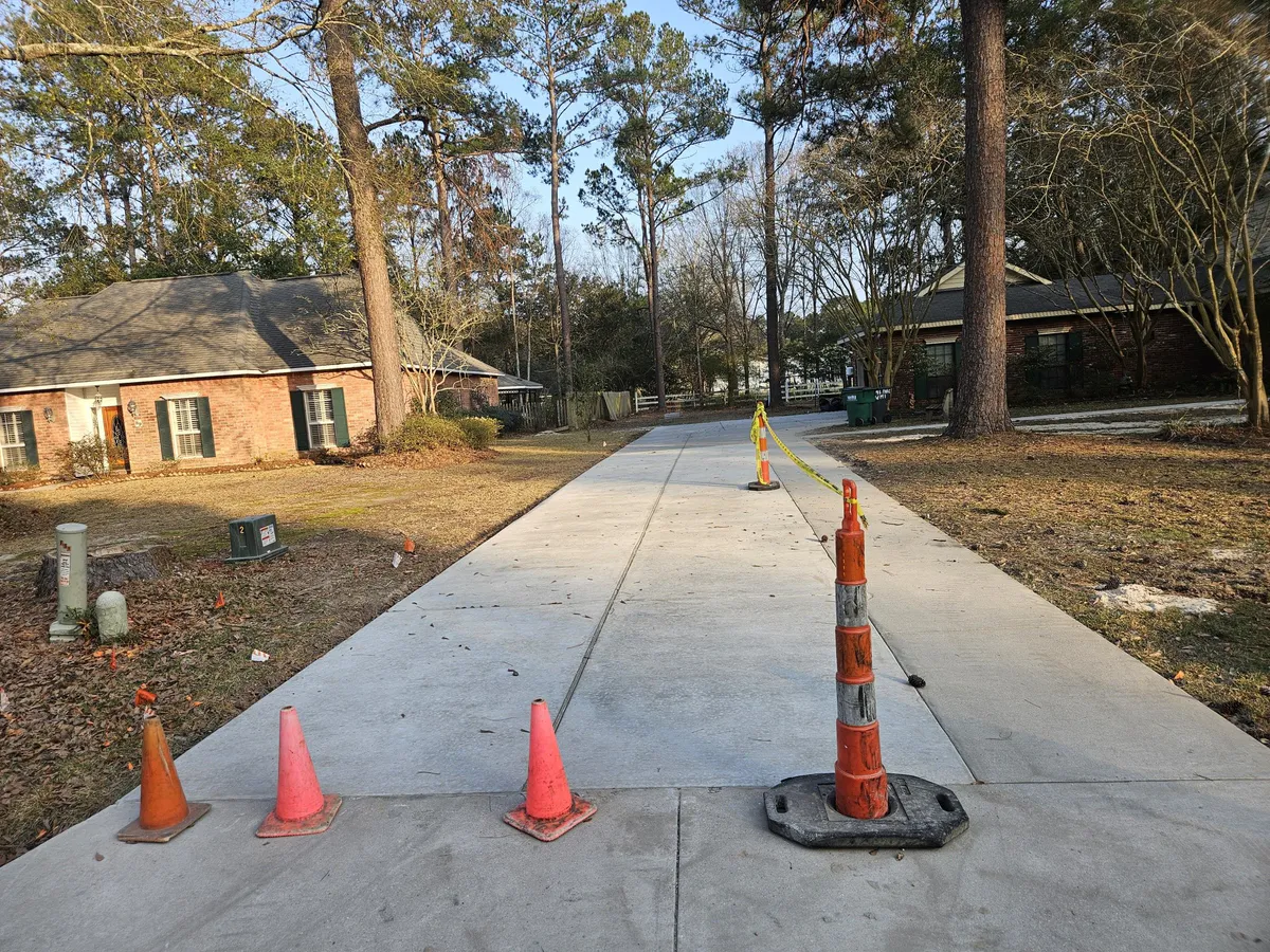 Concrete project near mature trees on residential property