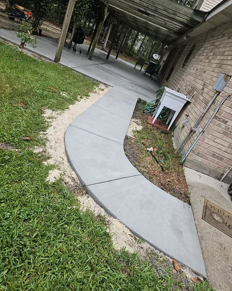 Concrete sidewalk installation in Mandeville
