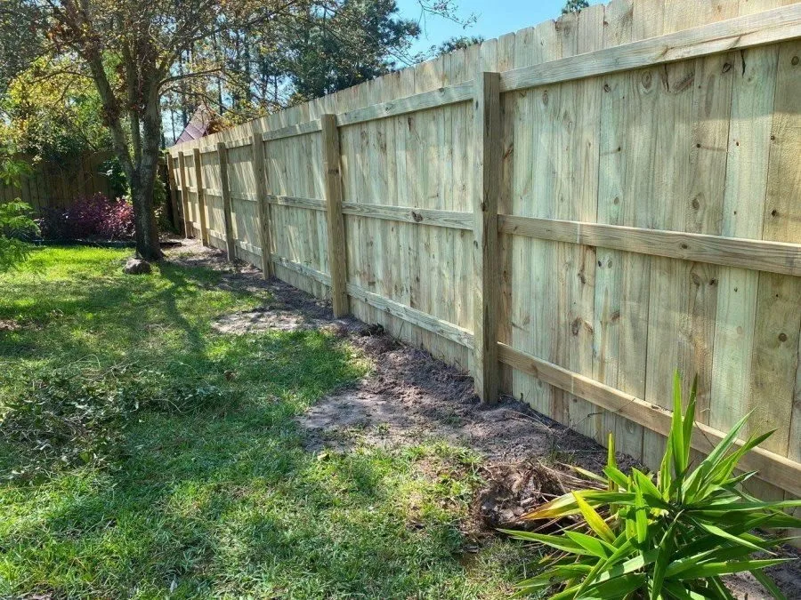 Wood privacy fence installation